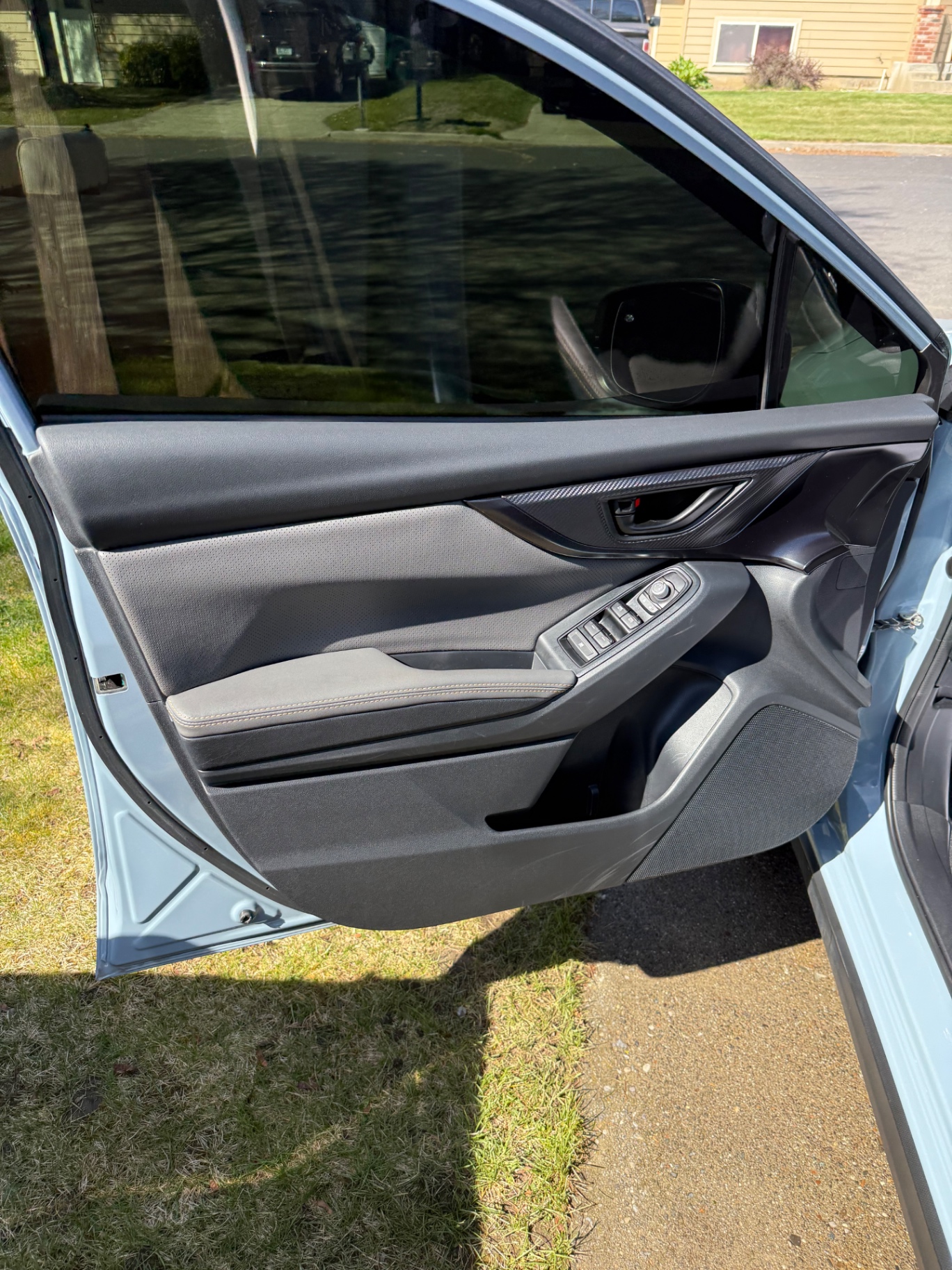 Spotless Subaru door panel after interior detail